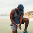 man kneeling and looking at the floor