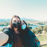 2 women take a selfie to show view of the bridge