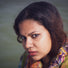 woman wears colorful scarf
